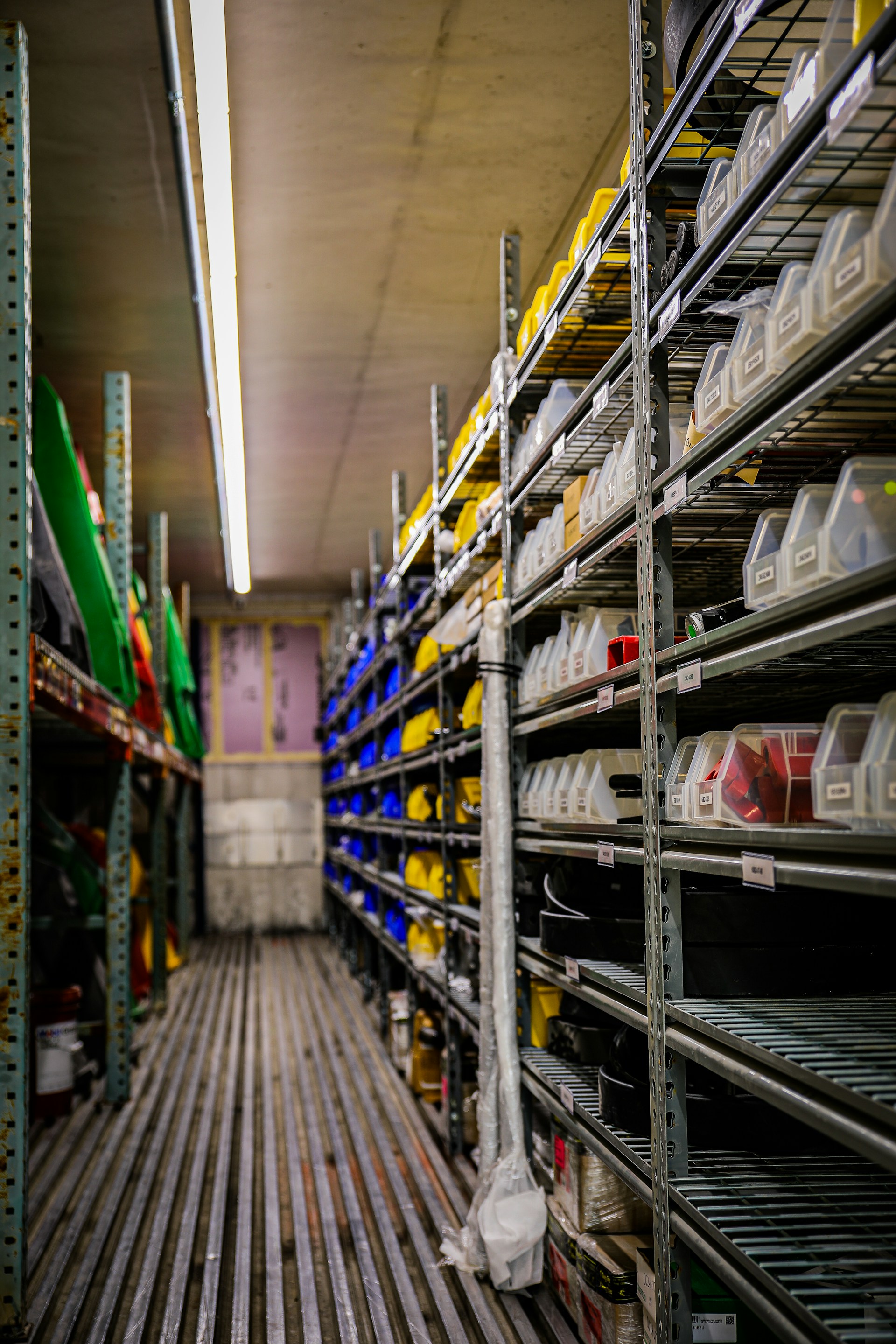 Shelving lined with labeled parts bins